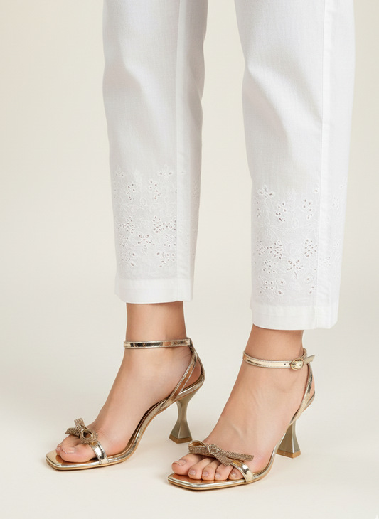 Person wearing golden heels 